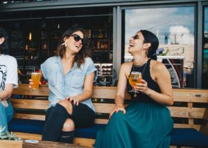 Ladies chatting while drinking beer